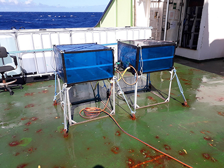 On-deck incubators on the back deck of RRS <em>James Cook</em> with flow through underway seawater supply for stable temperature
