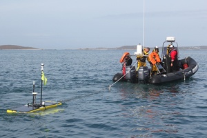 Waveglider being towed into position