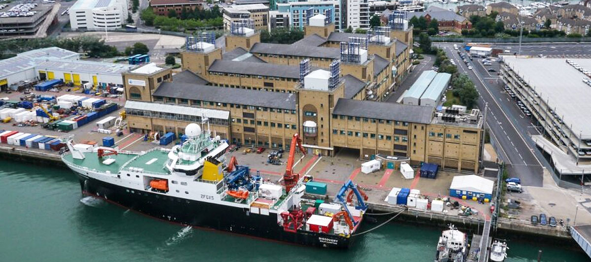 Image of RRS Discovery alongside the dock at the NOC, Southampton.